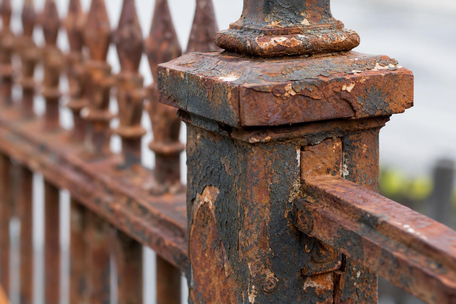 Rust removal from wrought iron railing, before and after sandblasting (before)